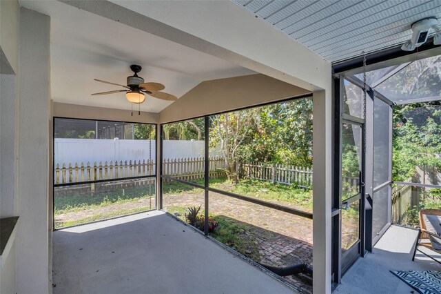 2462 Indian Trl E, Palm Harbor, FL 34683 - unfurnished sunroom with a ceiling fan, vaulted ceiling, and plenty of natural light