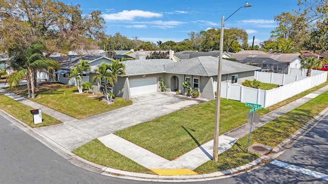 single story home with stucco siding, an attached garage, concrete driveway, and a front yard