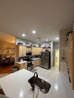 kitchen featuring recessed lighting, ceiling fan, light brown cabinetry, electric stove, and black fridge with ice dispenser