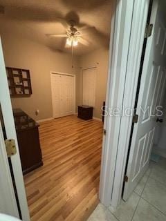 corridor featuring light wood-style flooring