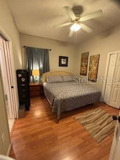 bedroom with wood finished floors and a ceiling fan