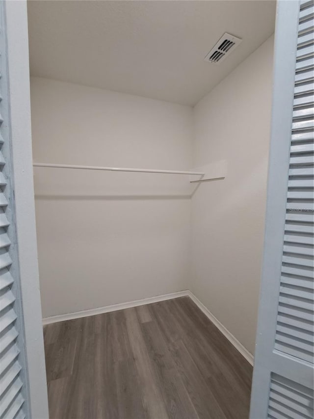 26 Clintwood Ave, Englewood, FL 34223 - spacious closet featuring dark wood-style floors