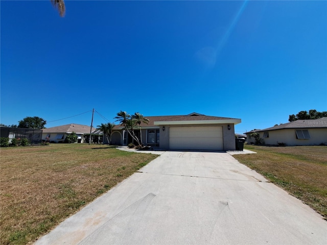26 Clintwood Ave, Englewood, FL 34223 - single story home with an attached garage, driveway, a front lawn, and stucco siding