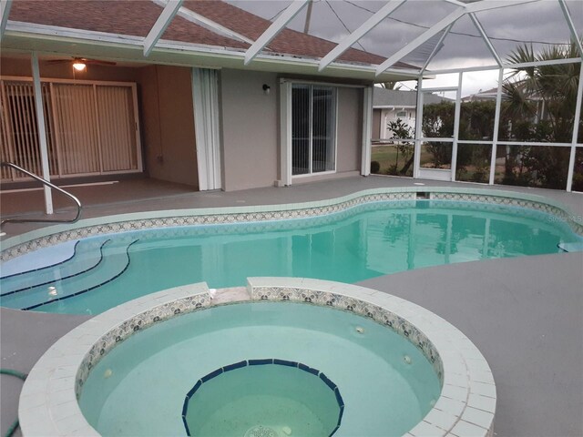 26 Clintwood Ave, Englewood, FL 34223 - view of swimming pool featuring a pool with connected hot tub, a lanai, and a patio
