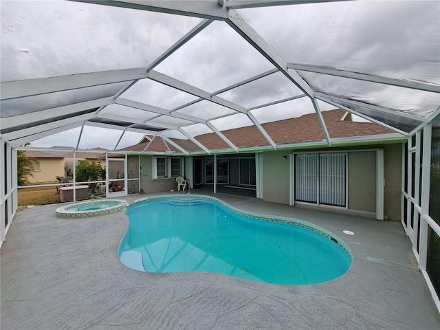 26 Clintwood Ave, Englewood, FL 34223 - view of swimming pool featuring a patio, glass enclosure, and a pool with connected hot tub