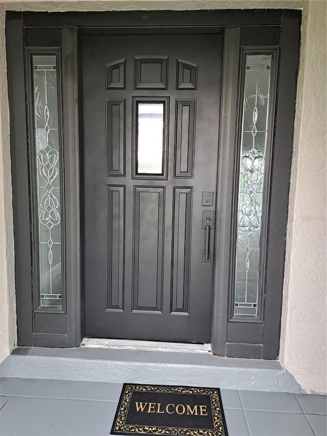 26 Clintwood Ave, Englewood, FL 34223 - property entrance featuring covered porch and stucco siding