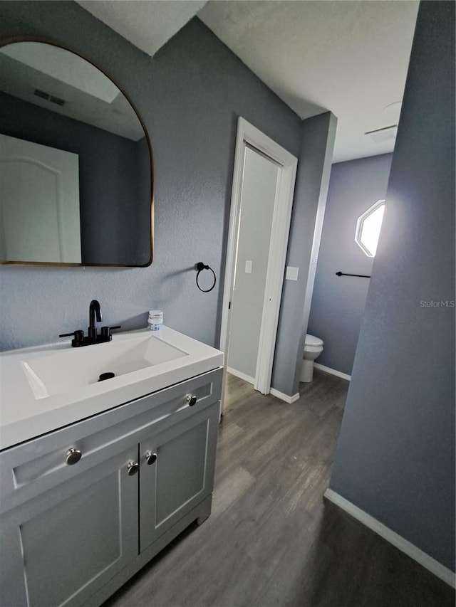 26 Clintwood Ave, Englewood, FL 34223 - bathroom with wood finished floors and vanity