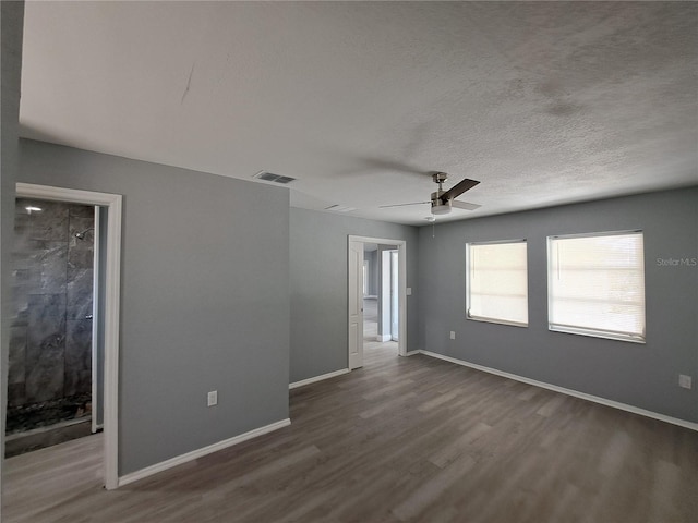 26 Clintwood Ave, Englewood, FL 34223 - spare room with wood finished floors, a ceiling fan, and a textured ceiling