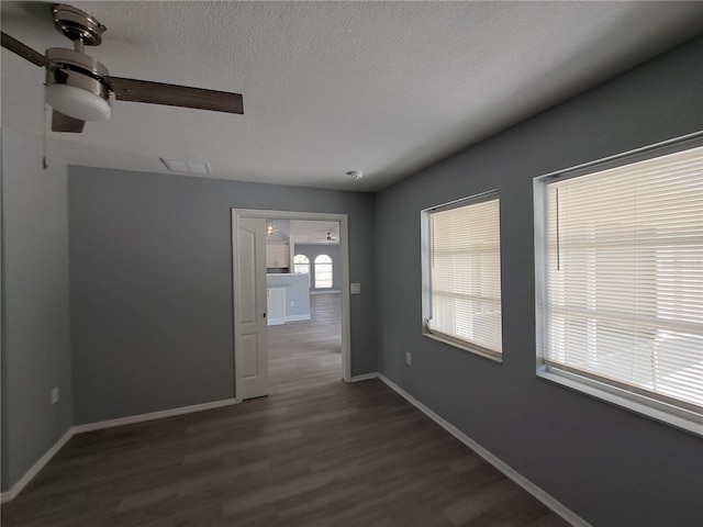 26 Clintwood Ave, Englewood, FL 34223 - unfurnished room featuring dark wood finished floors and a textured ceiling