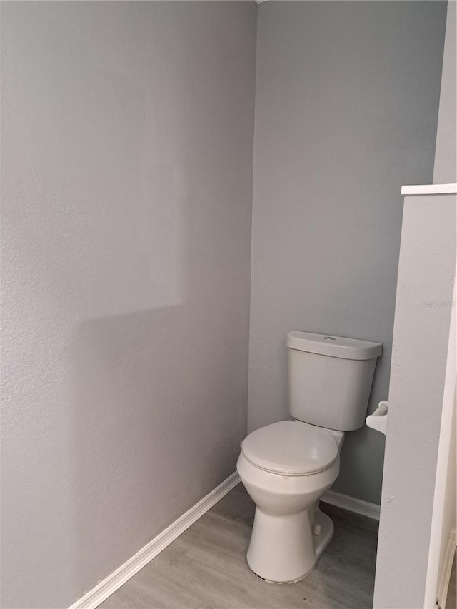 26 Clintwood Ave, Englewood, FL 34223 - bathroom featuring wood finished floors and toilet