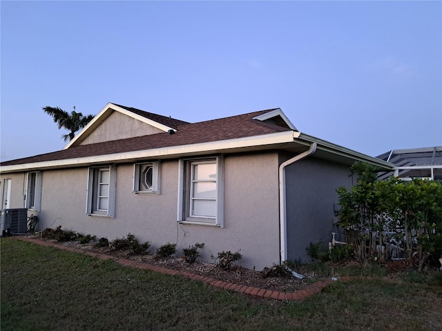 26 Clintwood Ave, Englewood, FL 34223 - view of side of home with stucco siding and a yard