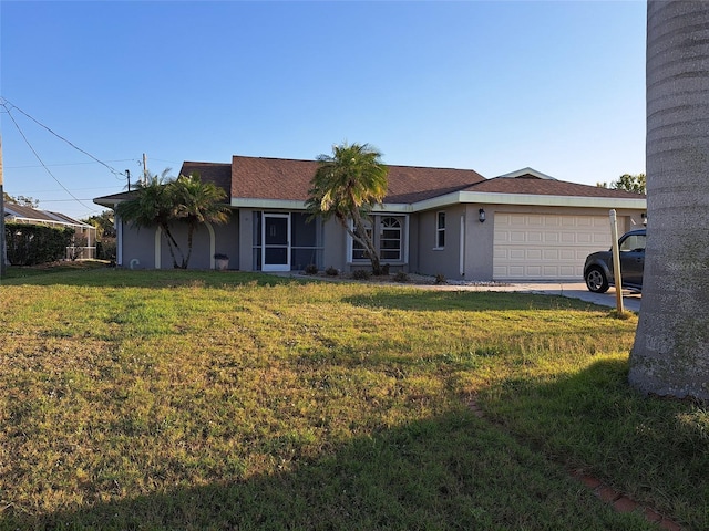 26 Clintwood Ave, Englewood, FL 34223 - single story home with stucco siding, an attached garage, a front yard, and concrete driveway