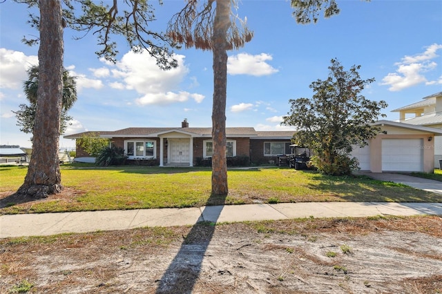 116 Shore Drive Pl, Oldsmar, FL 34677 - view of front facade with an attached garage, a chimney, and a front yard