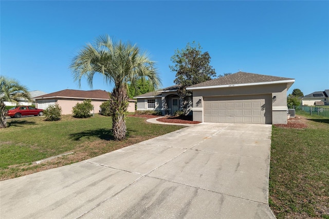 4575 NW 30th Pl, Ocala, FL 34482 - ranch-style home featuring a front lawn, stucco siding, a garage, and concrete driveway
