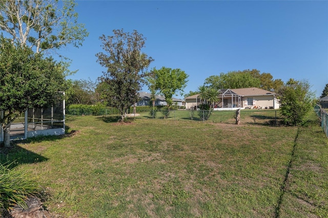 4575 NW 30th Pl, Ocala, FL 34482 - view of yard featuring a fenced backyard and glass enclosure