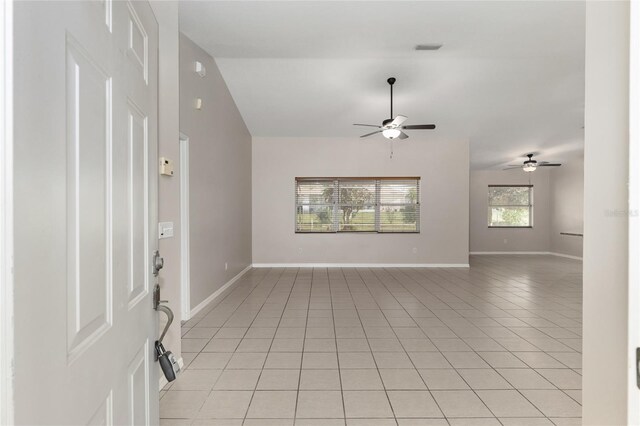 4575 NW 30th Pl, Ocala, FL 34482 - interior space with vaulted ceiling, light tile patterned floors, baseboards, visible vents, and ceiling fan