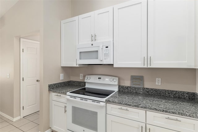 4575 NW 30th Pl, Ocala, FL 34482 - kitchen featuring white cabinets, white appliances, baseboards, dark stone counters, and light tile patterned floors
