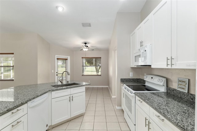 4575 NW 30th Pl, Ocala, FL 34482 - kitchen with visible vents, white appliances, white cabinetry, a sink, and light tile patterned floors