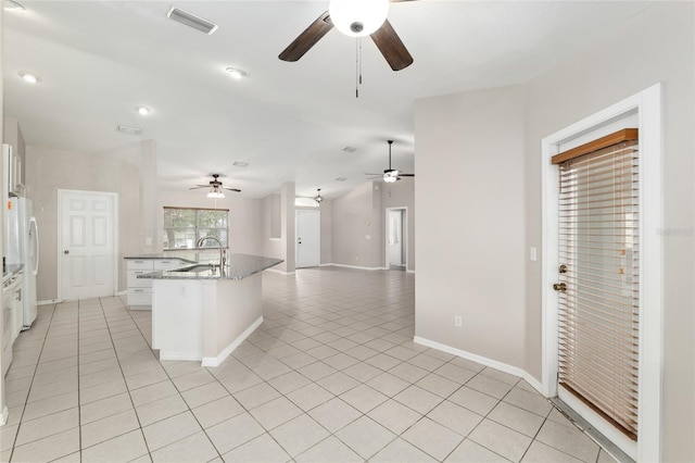 4575 NW 30th Pl, Ocala, FL 34482 - kitchen featuring light tile patterned floors, visible vents, a ceiling fan, and freestanding refrigerator