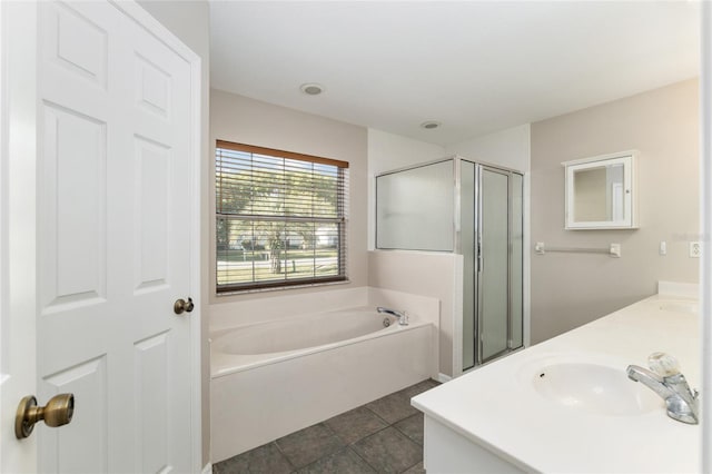 4575 NW 30th Pl, Ocala, FL 34482 - bathroom with tile patterned floors, a sink, a stall shower, double vanity, and a bath