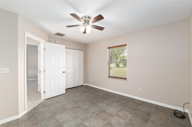 4575 NW 30th Pl, Ocala, FL 34482 - unfurnished bedroom featuring a ceiling fan, a closet, baseboards, and visible vents