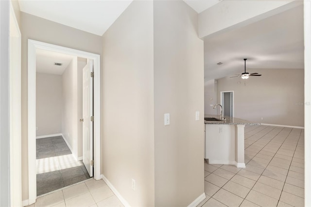 4575 NW 30th Pl, Ocala, FL 34482 - hallway with a sink, lofted ceiling, light tile patterned floors, baseboards, and visible vents