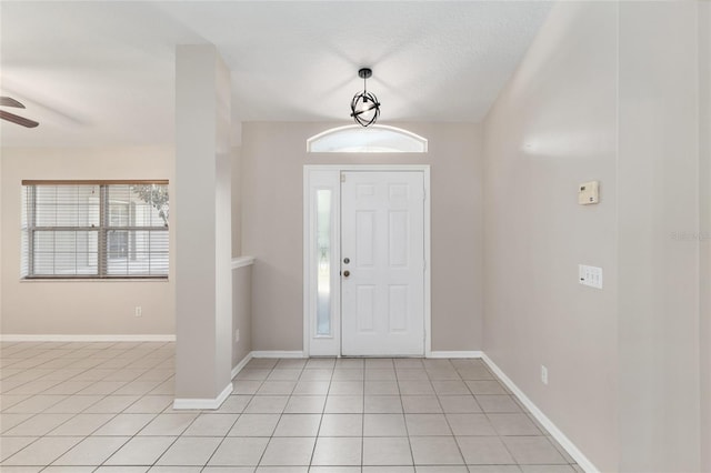 4575 NW 30th Pl, Ocala, FL 34482 - foyer with a ceiling fan, light tile patterned floors, and baseboards