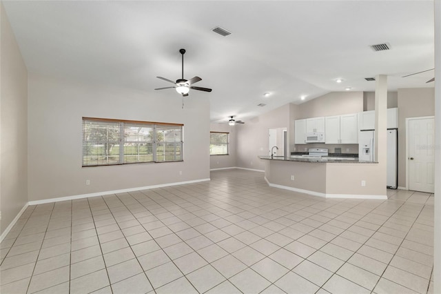 4575 NW 30th Pl, Ocala, FL 34482 - unfurnished living room featuring baseboards, a ceiling fan, lofted ceiling, a sink, and light tile patterned floors