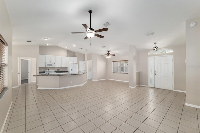 4575 NW 30th Pl, Ocala, FL 34482 - unfurnished living room featuring light tile patterned flooring, visible vents, baseboards, ceiling fan, and lofted ceiling