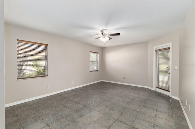4575 NW 30th Pl, Ocala, FL 34482 - empty room featuring baseboards and ceiling fan