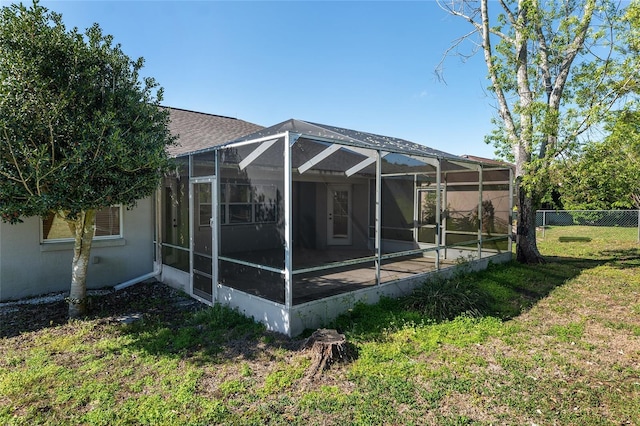 4575 NW 30th Pl, Ocala, FL 34482 - back of property featuring a lanai, fence, and a lawn