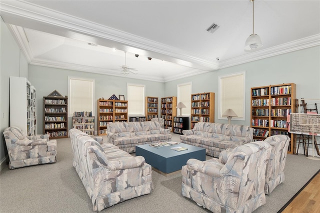 4575 NW 30th Pl, Ocala, FL 34482 - living area with bookshelves, crown molding, ceiling fan, and visible vents