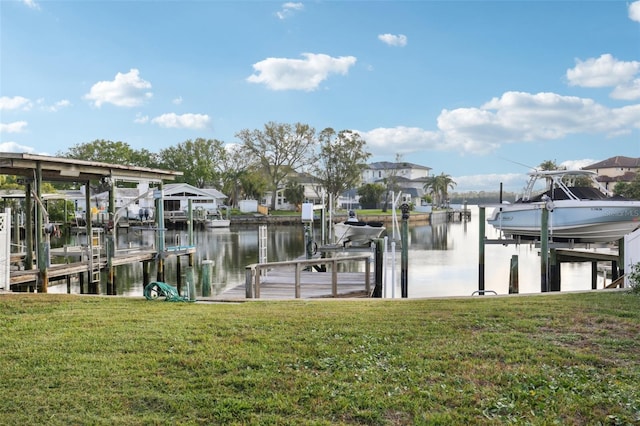 104 Carlyle Cir, Palm Harbor, FL 34683 - dock with boat lift, a water view, and a yard