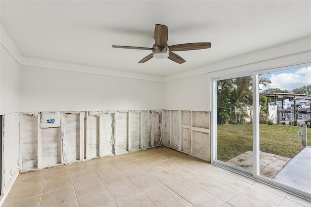 104 Carlyle Cir, Palm Harbor, FL 34683 - tiled empty room featuring ceiling fan and crown molding
