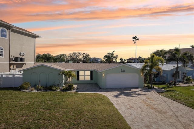 104 Carlyle Cir, Palm Harbor, FL 34683 - view of front facade with an attached garage, decorative driveway, and stucco siding
