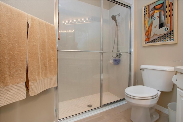 full bath with toilet and a shower stall