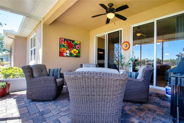 view of patio featuring outdoor dining space and a ceiling fan