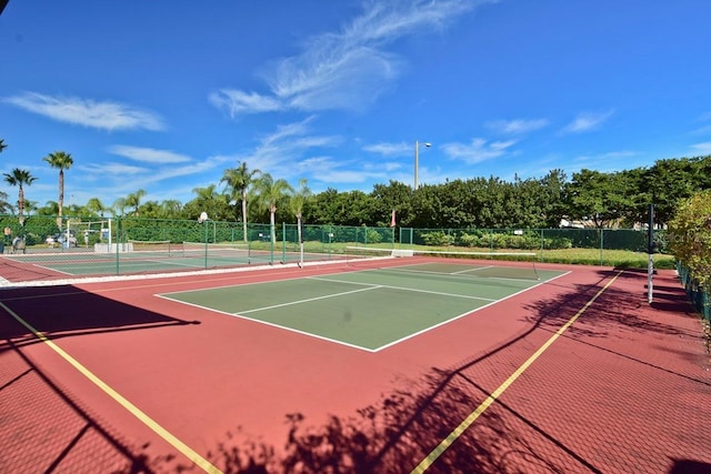 view of sport court featuring community basketball court and fence