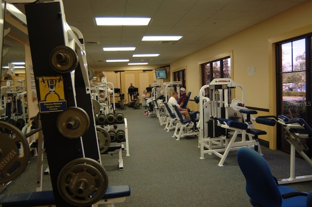 exercise room featuring visible vents and a drop ceiling