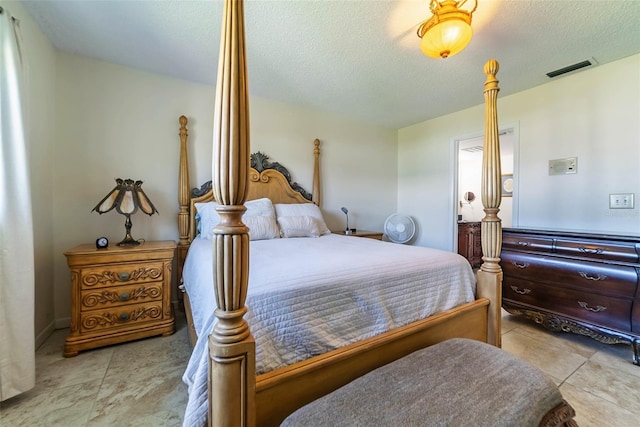5427 Springwood Blvd Unit 5427, Pinellas Park, FL 33782 - bedroom with light tile patterned flooring, a textured ceiling, and visible vents
