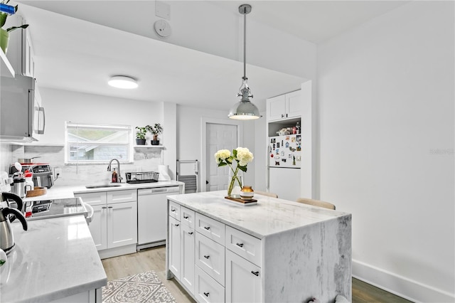 819 11th St N, Saint Petersburg, FL 33705 - kitchen featuring a sink, white appliances, white cabinetry, and open shelves