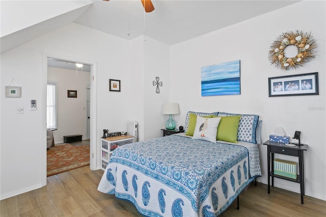 819 11th St N, Saint Petersburg, FL 33705 - bedroom featuring lofted ceiling, ceiling fan, and wood finished floors