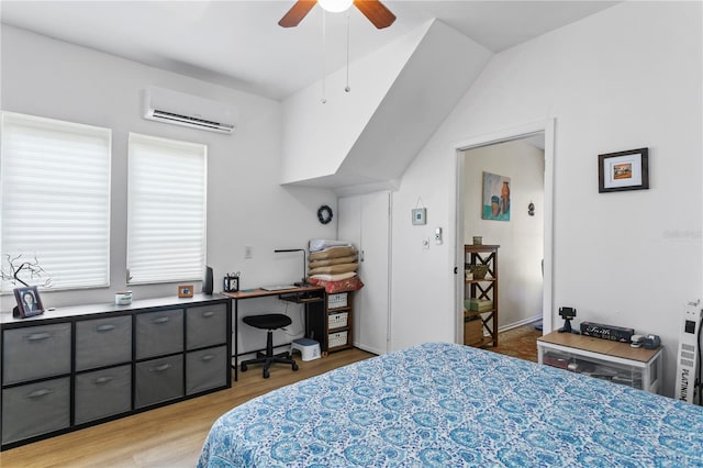 819 11th St N, Saint Petersburg, FL 33705 - bedroom featuring an AC wall unit, light wood-style floors, and ceiling fan