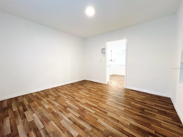 819 11th St N, Saint Petersburg, FL 33705 - unfurnished room with baseboards and wood finished floors
