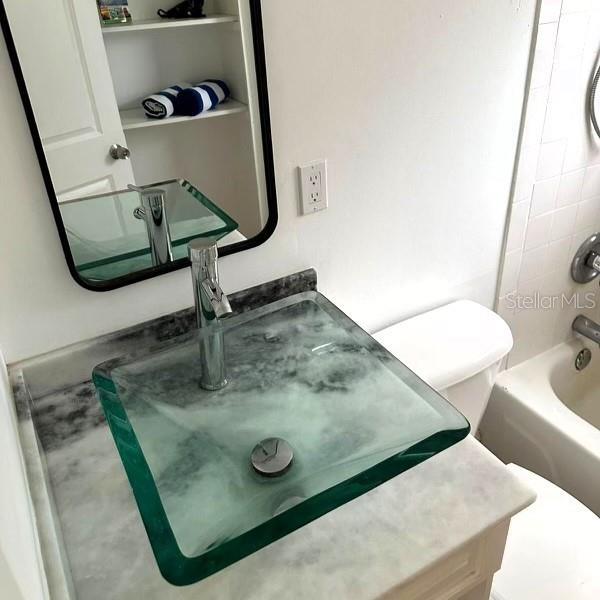 819 11th St N, Saint Petersburg, FL 33705 - full bath with shower / tub combination and a sink