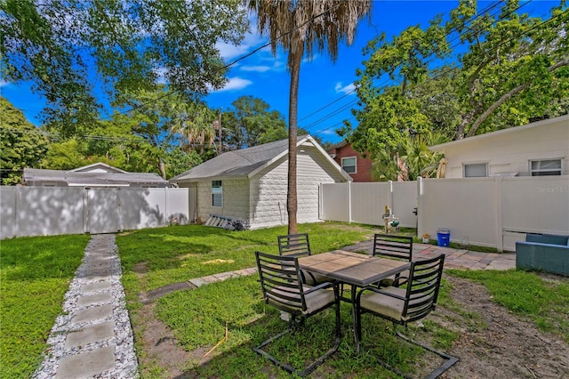 819 11th St N, Saint Petersburg, FL 33705 - view of yard with a fenced backyard