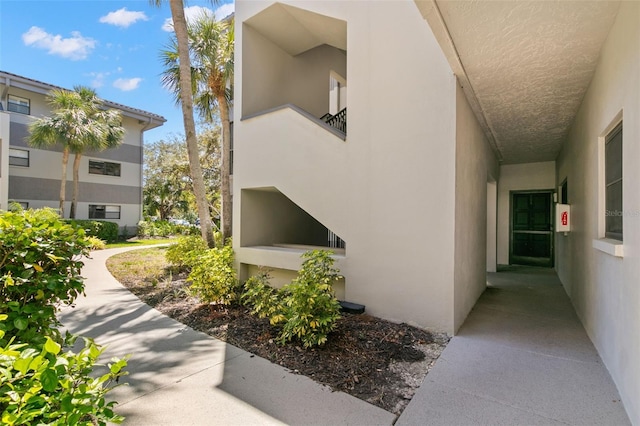 2650 Countryside Blvd Unit B102, Clearwater, FL 33761 - view of side of property featuring stucco siding
