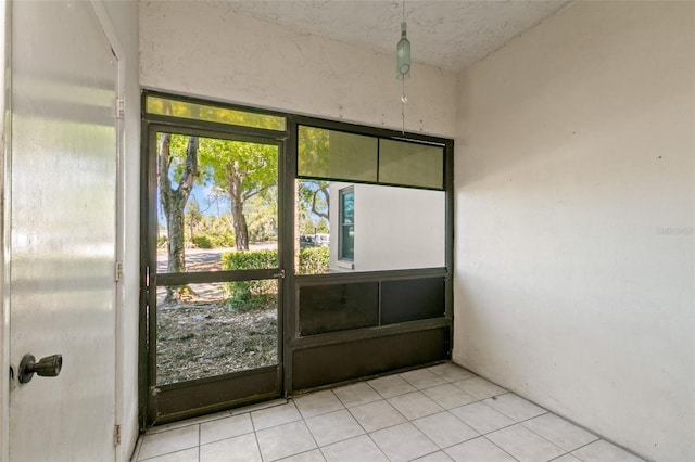 2650 Countryside Blvd Unit B102, Clearwater, FL 33761 - doorway to outside featuring light tile patterned floors