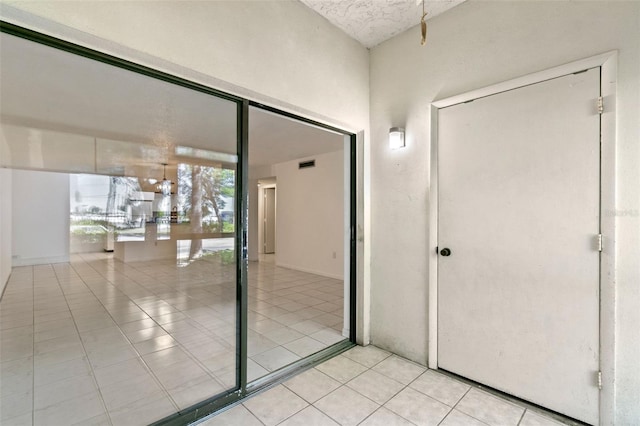 2650 Countryside Blvd Unit B102, Clearwater, FL 33761 - interior space with light tile patterned flooring and visible vents