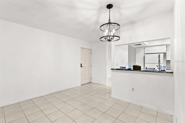 2650 Countryside Blvd Unit B102, Clearwater, FL 33761 - interior space featuring an inviting chandelier, light tile patterned floors, visible vents, and baseboards